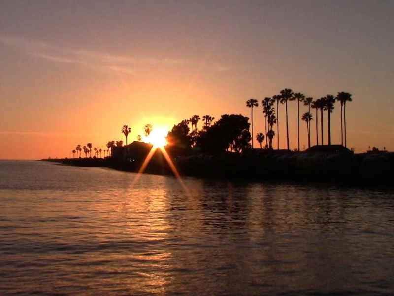 a sunset over a body of water