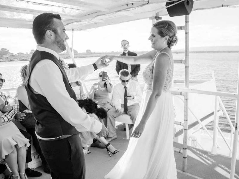 a group of people standing on a boat