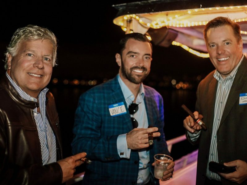 a group of people holding wine glasses