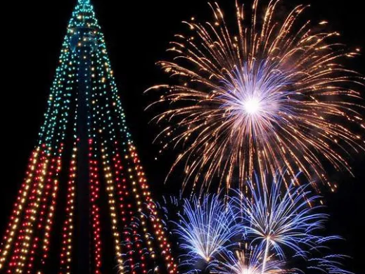 fireworks in the night sky with Cosmo Clock 21 in the background