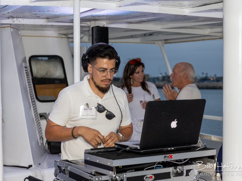 a man sitting in front of a laptop computer
