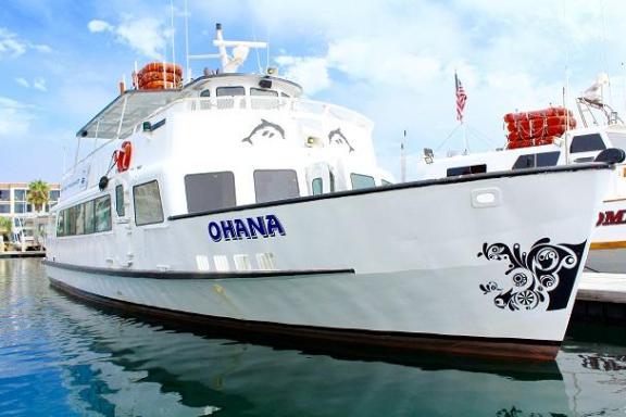 a boat is docked next to a body of water