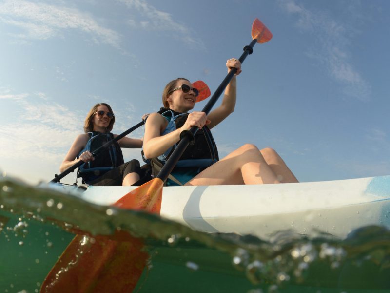 a man riding a wave on a surfboard in the water