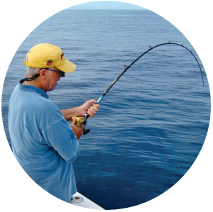 a man standing next to a body of water