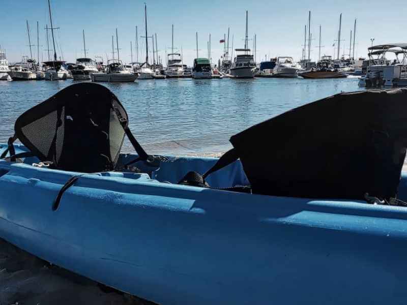 a boat is docked next to a body of water