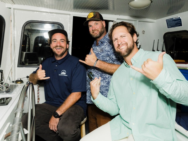 a person standing next to a train